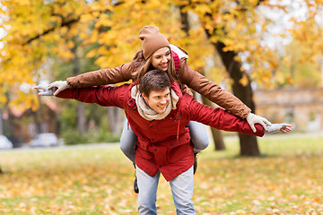 Image showing happy young couple having fun in autumn park