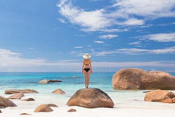 Image showing Woman enjoying Anse Lazio picture perfect beach on Praslin Island, Seychelles.