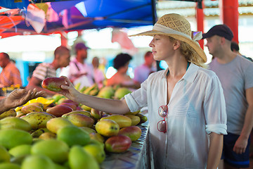 Image showing Traveler shopping on traditional Victoria food market, Seychelles.