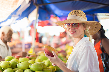 Image showing Traveler shopping on traditional Victoria food market, Seychelles.