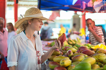 Image showing Traveler shopping on traditional Victoria food market, Seychelles.