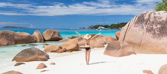 Image showing Woman enjoying Anse Lazio picture perfect beach on Praslin Island, Seychelles.