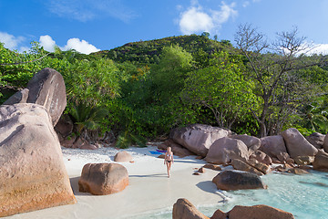 Image showing Woman enjoying Anse Lazio picture perfect beach on Praslin Island, Seychelles.