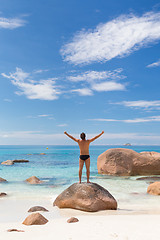 Image showing Woman enjoying Anse Lazio picture perfect beach on Praslin Island, Seychelles.