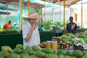 Image showing Traveler shopping on traditional Victoria food market, Seychelles.