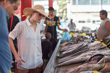 Image showing Traveler shopping on traditional Victoria fish market, Seychelles.