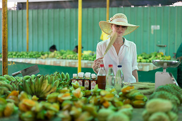 Image showing Traveler shopping on traditional Victoria food market, Seychelles.