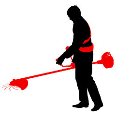 Image showing Silhouette worker of a garden cuts off  grass. 