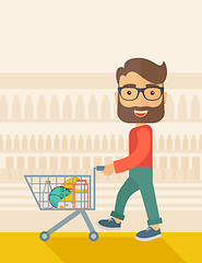 Image showing Male Shopper Pushing a Shopping Cart.