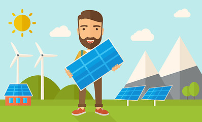 Image showing Man holding a solar panel.