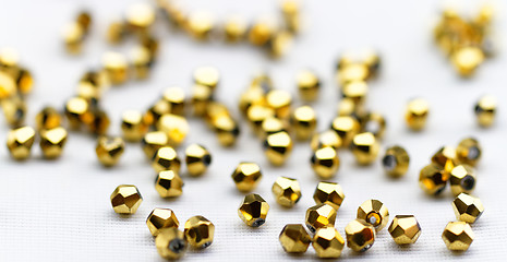 Image showing Golden glass beads