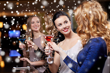 Image showing happy women with drinks at night club