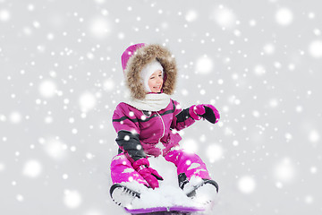 Image showing happy little kid on sled outdoors in winter