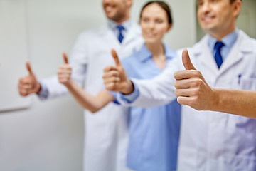 Image showing close up of doctors at hospital showing thumbs