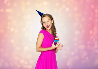 Image showing happy woman or teen girl with birthday cupcake