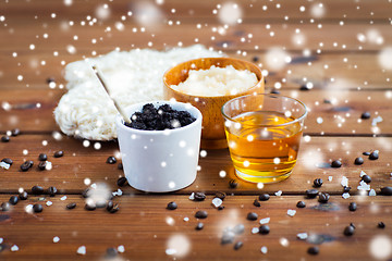 Image showing coffee scrub in cup and honey on wood