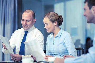 Image showing business people with papers meeting in office