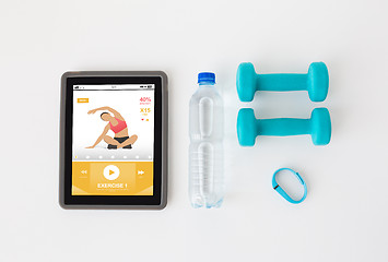 Image showing tablet pc, dumbbells, fitness tracker and bottle