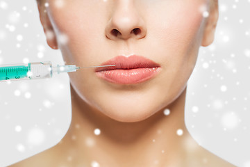 Image showing close up of woman face and syringe injection