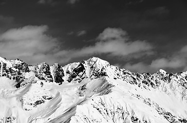 Image showing Black and white view on snowy mountains in sunny day