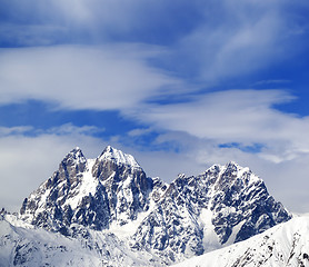 Image showing Mounts Ushba and Chatyn and blue sky with clouds in winter wind 