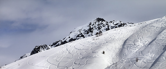 Image showing Panoramic view on off-piste slope with traces from skis and snow