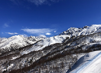 Image showing Snow mountain and ski slope in sun day