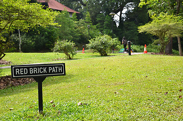 Image showing Singapore Botanic Garden With red brick path