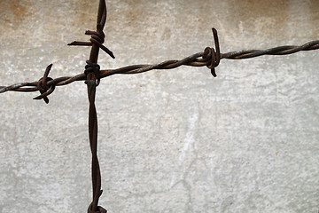 Image showing Rusted spiked fence