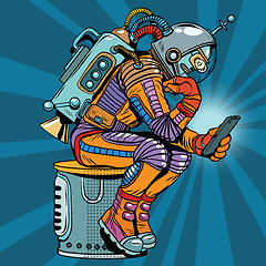 Image showing Retro robot astronaut in the thinker pose reads smartphone