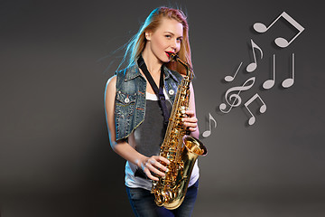 Image showing beautiful blonde as saxophonist woman 