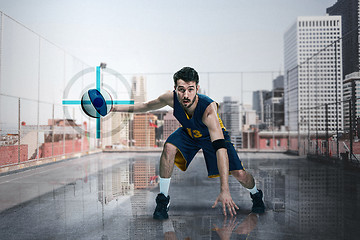 Image showing Full length portrait of a basketball player with ball