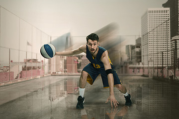 Image showing Full length portrait of a basketball player with ball