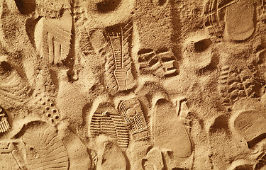 Image showing prints from various footwear on sand 