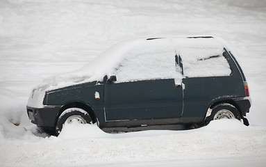 Image showing  small car covered with snow