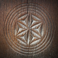 Image showing carved symbol on ancient wood