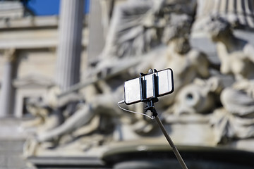 Image showing Smartphone with selfie stick 