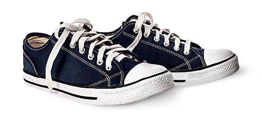 Image showing One pair of dark blue sports shoes beside