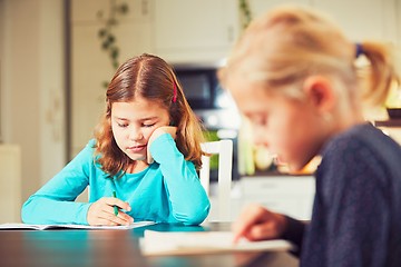 Image showing Siblings are doing homework