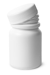 Image showing Single plastic bottle with cover removed for pills