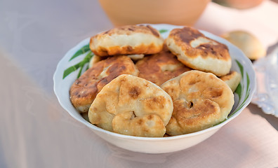 Image showing Cakes on a ceramic dish on the table.