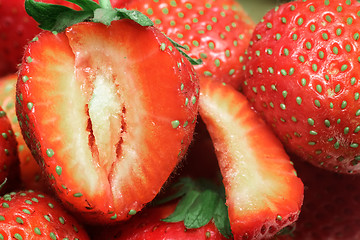 Image showing Cut a ripe strawberry to the major plan.