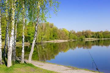 Image showing Large beautiful lake, with banks overgrown with forest.