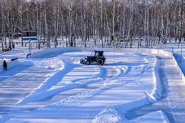 Image showing Removing snow from the pitch