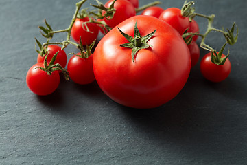 Image showing Cherry Tomatoes on Black Stone