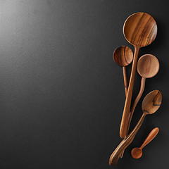 Image showing Wood spoons on black board background