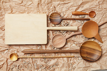 Image showing wooden kitchen utensil on baking paper