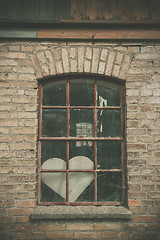 Image showing Forgotten love heart in a window 