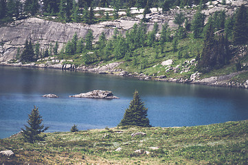 Image showing Mountain lake with pine trees