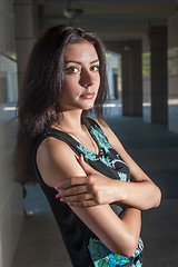 Image showing Beautiful young girl in dress in town